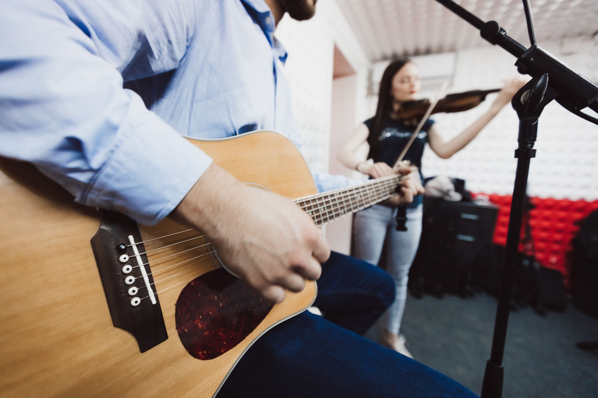 Two musicians in a recording studio